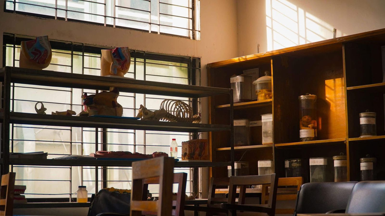 A room with shelves and chairs AI-generated content may be incorrect.