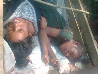 দোহালিযা গ্রামের একপরিবারের দুজন প্রতিবন্ধি বোন।