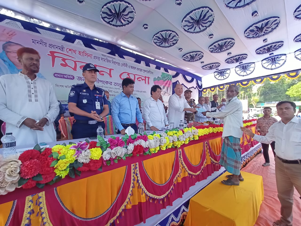 মাননীয় প্রধানরমন্ত্রীর সহায়তা/সামাজিক নিরাপত্তা বেষ্টনীর উপকারভোগীদের মিলন মেলা উন্নয়ন সমাবেশ